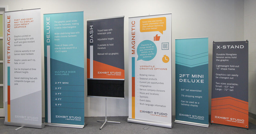 a guide to portable banner stands for trade shows, events, and advertising. A row of various retractable banner stands are shown in Calgary, Alberta.
