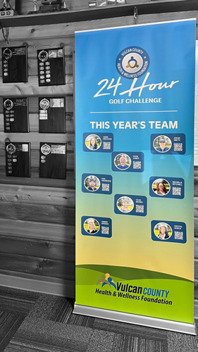 magnetic banner stand for an Alberta charity golf event in Vulcan county. Each team member has a magnetic graphic with their name, photo, and QR code to donate. 