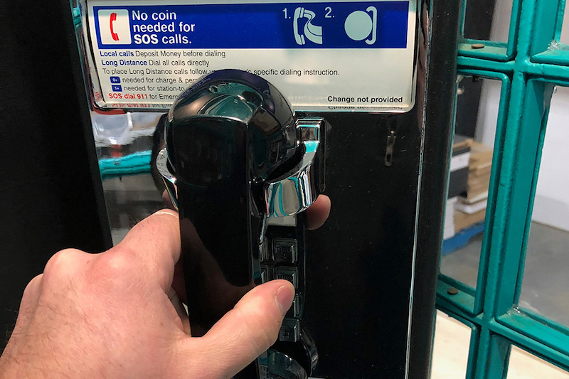 close up of a phone within a phone booth for a christmas experiential marketing event. Users could leave a voicemail for Santa with a customized electronics system