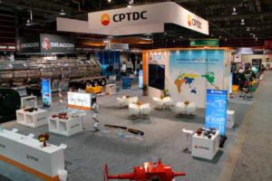 custom trade show display booth at the Global Energy Show in Calgary, Alberta. The display includes hanging fabric signs, a double story video wall and private meeting area, wall graphics, custom branded counters, backlit banners, and meeting areas along with product demonstration areas.