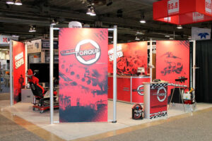 Customized rental trade show booth at the Global Energy Show in Calgary, Alberta. The display includes back walls with graphics, free standing vinyl banner panels, and a VR demonstration area along with a portable branded podium.