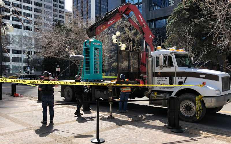 delivering a branded phone booth for a marketing activation. This had to be moved with a large flatbed truck and crane due to its weight. 