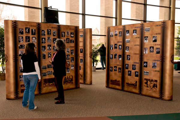 four 8ft portable pop-up displays are set up in an "x" shape that showcase a variety of historical sports figures in Alberta.