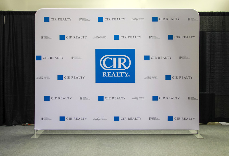 portable 10ft fabric wall backdrop with a local real estate company logo 