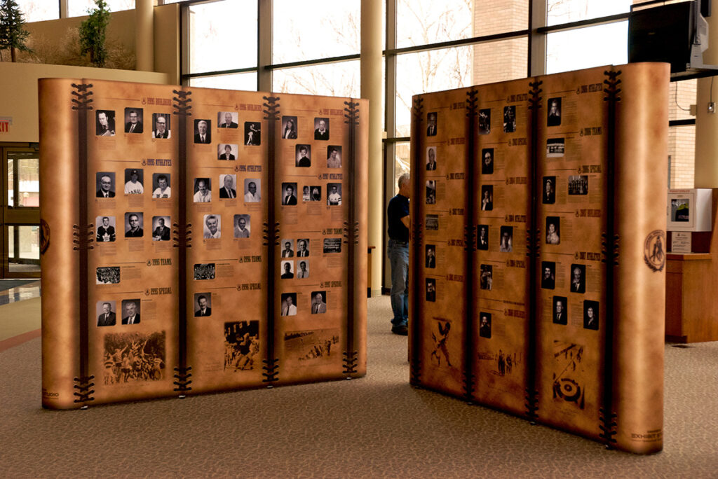 series of portable pop-up displays arranged in an "x" configuration for a temporary museum exhibit pop-up in Alberta.