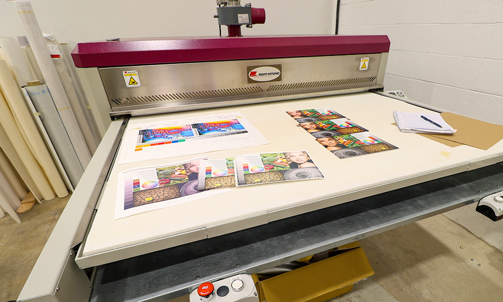 Dye Sublimation Heat Press showing multiple test prints at our studio in Calgary, Alberta